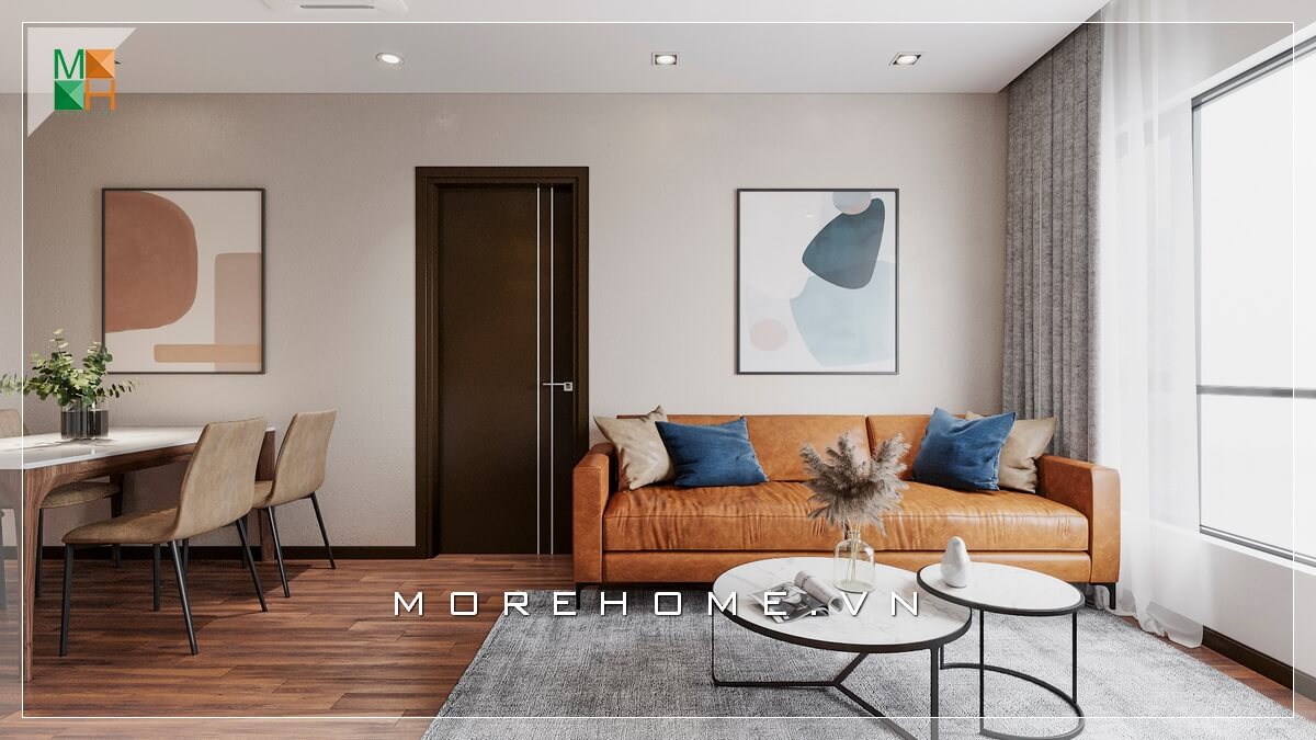 Giới thiệu mẫu ghế sofa bọc da bò nổi bật phù hợp với không gian phòng khách chung cư đơn giản, kết hợp mẫu bàn độc đáo 2 mặt tròn chồng lên nhau khiến căn phòng khách trở nên hiện đại và sang trọng hơn. Các cách bày trí phòng khách sang trọng